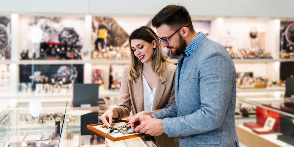 couple looking at watches in store